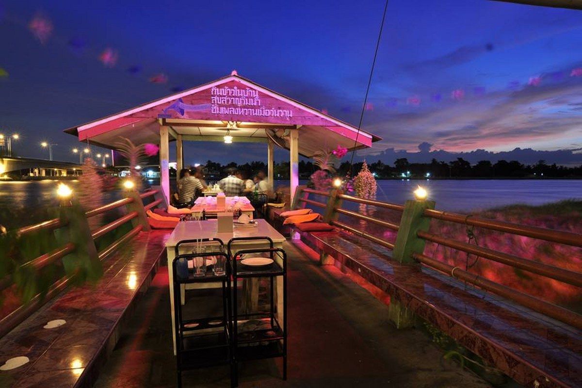Riverside dining deck at sunset